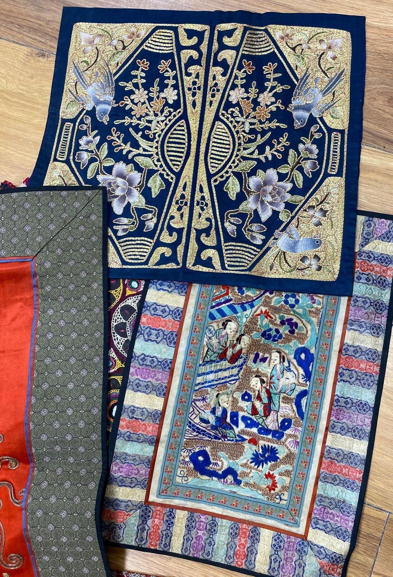 A collection of Chinese embroidered panels, a beaded Portuguese pocket, an Indian mirrored panel and a 19th century